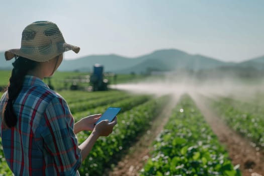 Skilled farmer standing at rice field sunset and using phone to inspect crop. Smart agricultural people or researcher checking his crop while standing at farm. Agriculture sustainable concept. AIG42.