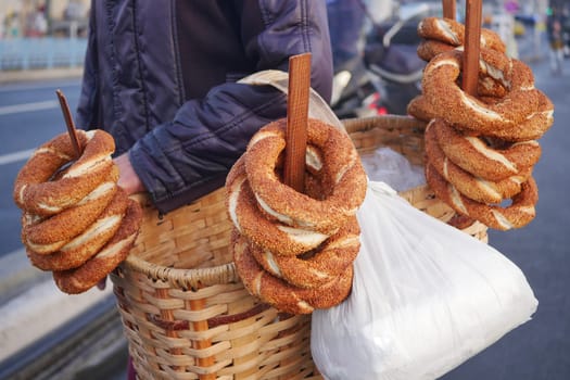young man selling Turkish Bagel Simit at istanbul street ,