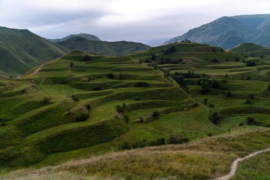 Chokhsky terraces Dagestan. Landscape of mountainous Dagestan with terraced fields and peaks mountains in the distance