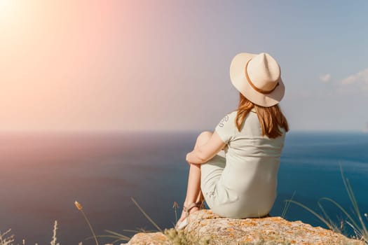 Woman travel sea. Happy carefree sensual woman with long hair in black swimwear posing at sunset beach. Silhouette of young beautiful playful positive woman outdoor. Summer vacation and trip concept