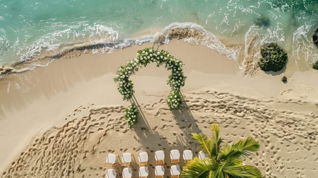 An aerial view of a beach wedding ceremony with chairs and flowers overlooking the water, surrounded by nature and plantfilled landscape AIG50