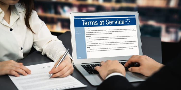 Online term of service conditions showing savvy rules and regulations in using the website on a laptop computer screen for users to make an agreement