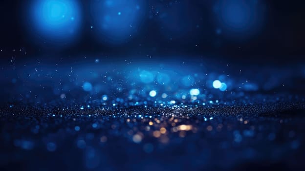 Bokeh lights on a gradient blue background. numerous sparkly gold particles of various sizes scattered around. These appear to be round and flat, and some have a slight blur around the edges. AIG35.