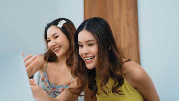 Two influencer partner shoot live streaming vlog video review makeup social media or blog. Happy young girl with vivancy cosmetics studio lighting for marketing recording session broadcasting online.