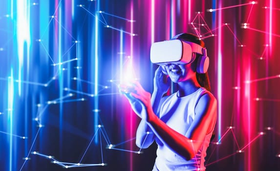 Smart female standing in cyberpunk style building in meta wear VR headset connecting metaverse, future cyberspace community technology, Woman use finger touching virtual reality object. Hallucination.