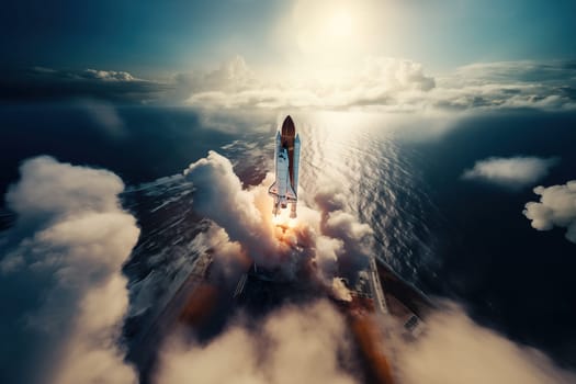 Aerial view of a rocket shuttle carrier launch at sunrise over an ocean coast. The rocket is blasting off with a trail of smoke and flames behind it.