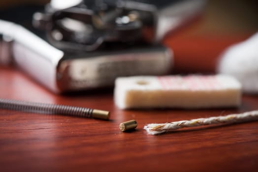 Disassembling of Lighter. Closeup at the flint. Shallow depth of field.