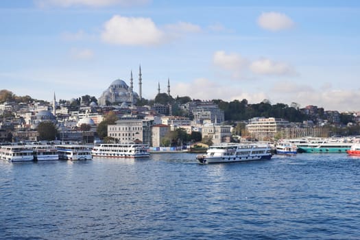 turkey istanbul 19 june 2023. ferryboats parked in the terminal in the Bosphorus river nearby the Eminonu Mosque.