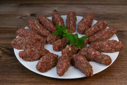 RECIPE FOR LEBANESE KEBBE NAYYHE, RAW MINCED BEEF, MARJORAM, MINT, ONIONS, CRUSHED WHEAT, SEVEN SPICES, CINNAMON, CAYENNE PEPPER. High quality photo