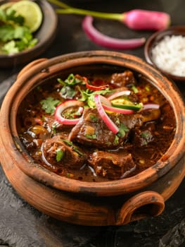 Authentic Pakistani nihari, a slow-cooked spicy beef stew simmered to perfection in a traditional clay pot. This fragrant and flavorful ethnic dish showcases the rich culinary heritage cuisine