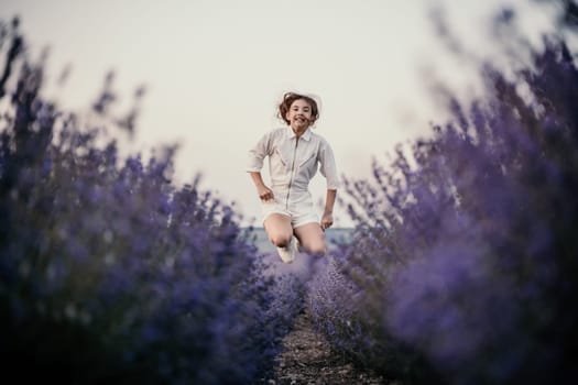 Lavender field happy girl in white dress with a scythe runs through a lilac field of lavender. Aromatherapy travel.