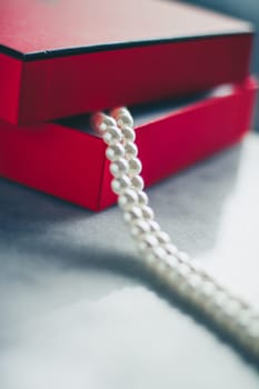 wonderful pearls in a red gift box, luxe present - jewellery and luxury gift for her styled concept, elegant visuals