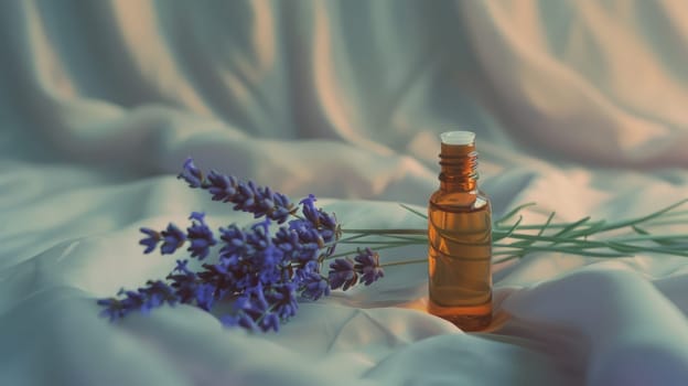 A sleek lavender oil bottle beside a fresh sprig of lavender, Lavender herb and essential aromatherapy oil.