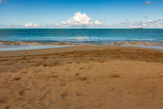 Caribbean beach with white sand, deep blue sky and turquoise water