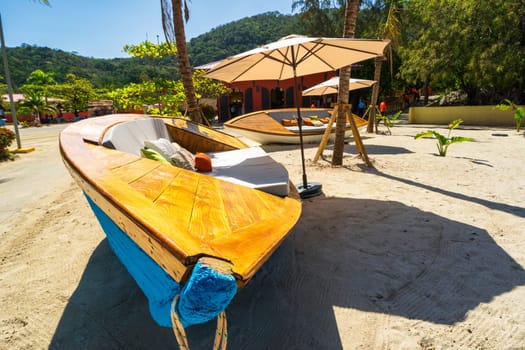 Umbrellas and sunbeds by the exotic tropical beach, Haiti, Caribbean Sea