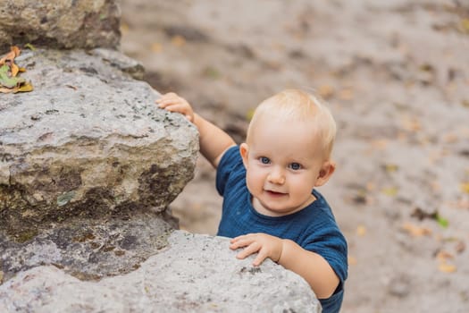 Baby tourist at Coba, Mexico. Ancient mayan city in Mexico. Coba is an archaeological area and a famous landmark of Yucatan Peninsula. Cloudy sky over a pyramid in Mexico.