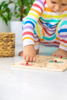 Child learns numbers game logic. Selective focus. Baby.