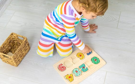 Child learns numbers game logic. Selective focus. Baby.