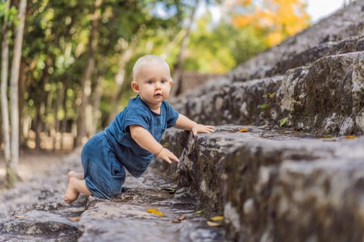 Baby tourist at Coba, Mexico. Ancient mayan city in Mexico. Coba is an archaeological area and a famous landmark of Yucatan Peninsula. Cloudy sky over a pyramid in Mexico.