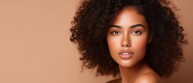 Beauty portrait of pretty young African woman with curly hair, beautiful lovely model posing on beige studio background