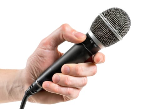A microphone is being held by a person's hand.