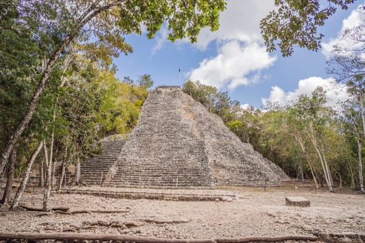 Coba, Mexico. Ancient mayan city in Mexico. Coba is an archaeological area and a famous landmark of Yucatan Peninsula. Cloudy sky over a pyramid in Mexico.