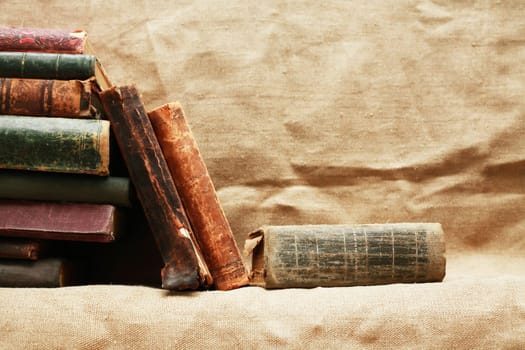 Set of various old books on canvas background