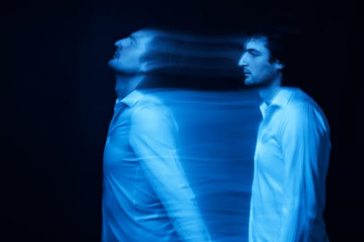 blurred silhouette of a ghost man's soul on a dark background