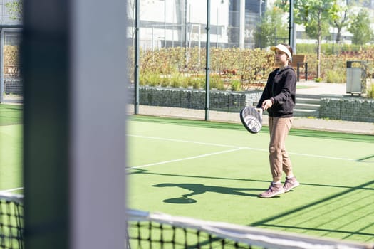 Young girls playing padel on a sunny day. High quality photo