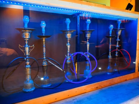 hookah with pipe and bowls to stay with the blue color of the room Smoking area