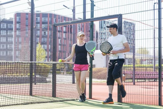 paddle tennis couple players ready for class. High quality photo