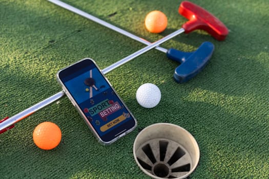 mini golf sports betting on a smartphone. High quality photo