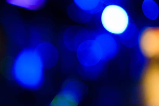abstract blurred background with blue circular bokeh