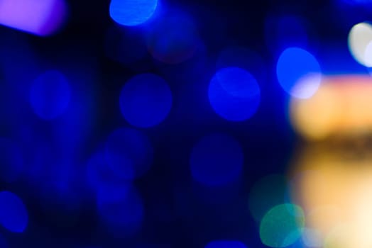 background with blue bokeh circles on a dark