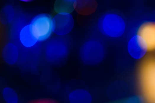 blurred blue background with a round of festive bokeh