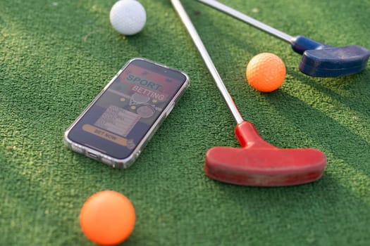 mini golf sports betting on a smartphone. High quality photo