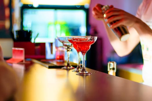 glass of red cocktail in the bar at the party