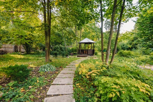 gazebo for relaxing in summer Park among the trees