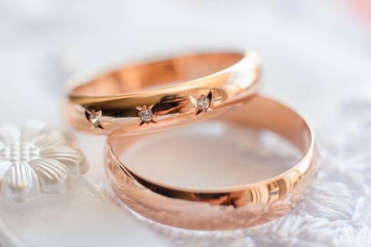 pair of gold wedding rings close-up for a wedding ceremony