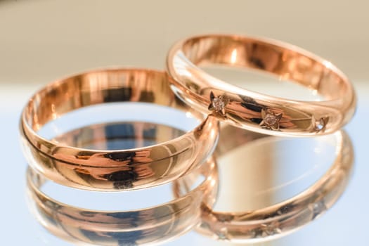 pair of gold wedding rings close-up for a wedding ceremony