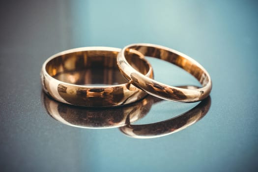 pair of gold wedding rings close-up for a wedding ceremony
