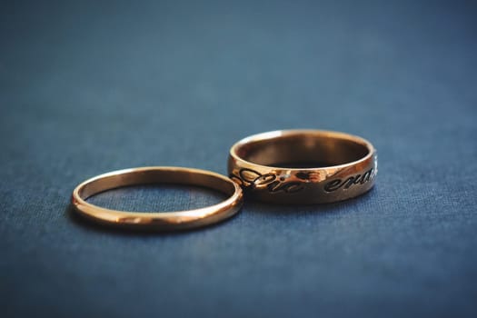 pair of gold wedding rings close-up for a wedding ceremony