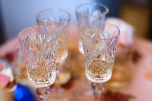 group of empty shot glasses for vodka in the pub are on the table