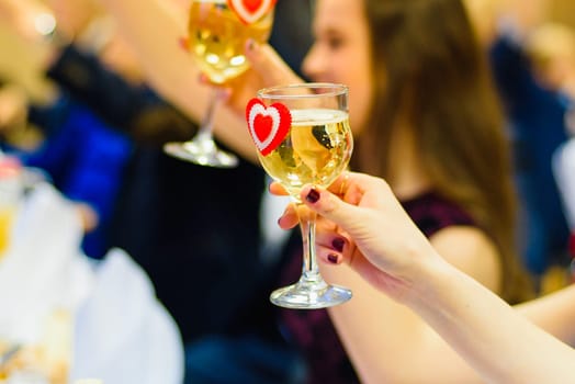 toast a glass of white wine in hand at the festival