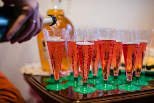 red wine poured in a variety of plastic cups
