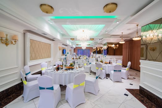 Banquet hall luxurious bright white decorated for your wedding reception