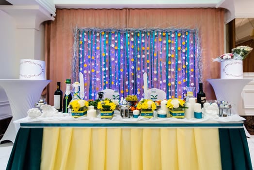 Bridal table for a romantic dinner in decorated restaurant
