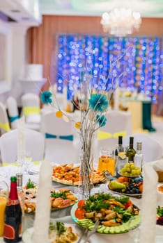wedding decorated table with food and drinks in the beautiful Banquet hall of the restaurant