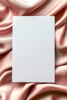 Minimalist aesthetic mockup of white blank A5 envelope on pink silk fabric.