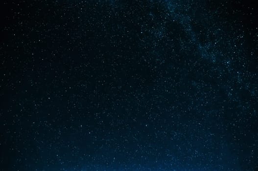 starry sky with the milky way on a dark blue background